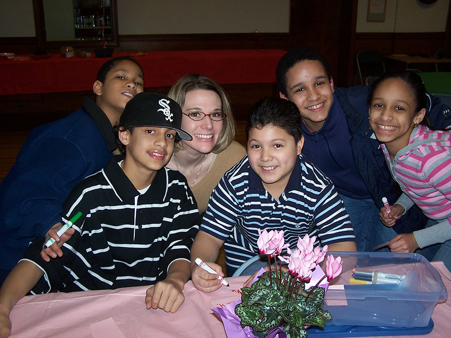 Heather Ruple serving with the young Miguel Men at San Miguel School Providence, RI